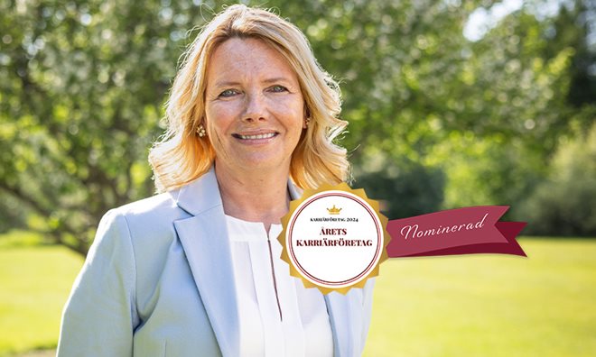 A female HR manager standing in a garden with a logo on it